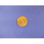 A George V gold half Sovereign, dated 1914.