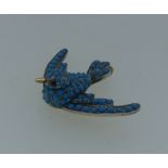 An attractive turquoise Pendant, of a swallow in flight, pave set body with amethyst eyes, mounted