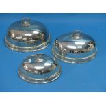 A graduated set of three silver plated Meat Domes, of traditional form with removable ring