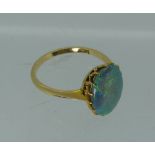 An opal RIng, the oval stone mounted in 18ct yellow gold, approx 13mm x 10mm, Size O½.