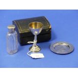 An early 20thC cased silver three piece Travelling Communion Set, unmarked but tested as silver,