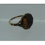 An antique love-token Ring, circa 1810, the circular centre set with a foiled orange topaz