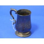 A George III silver Mug, by Charles Hougham, hallmarked London, 1785, of baluster form with leaf