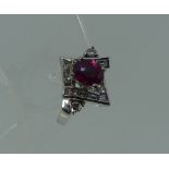 An attractive ruby and diamond Dress Ring, the front set with two overlapping V shapes, each set
