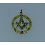 Masonic Jewellery; An 18ct yellow gold and diamond Pendant, of circular form with compass and set