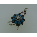 An attractive Pendant, in the form of a flower head, set with seed pearls, turquoise and pale