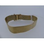 A 9ct yellow gold flexible mesh link Bracelet, approx total weight 26.2g.