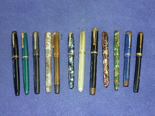 A collection of mid 20thC Fountain Pens, including a Parker Duofold Lucky Curve, Conway Stewart