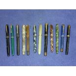 A collection of mid 20thC Fountain Pens, including a Parker Duofold Lucky Curve, Conway Stewart