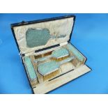 A cased George V silver mounted Dressing Table Set, by Albert Carter, hallmarked Birmingham, 1928,