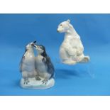 A Nymphenburg porcelain Polar Bear, 8½in (21.5cm) high, and a Porsgrunds porcelain group of two