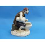 A Royal Worcester porcelain figure of an Eastern Turkish water carrier, he wearing a red fez and