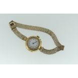 A continental 18ct gold and diamond set lady's Cocktail Watch, the circular white enamel dial with