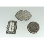 A small quantity of silver, including a silver buckle, white metal filigree circular pot and