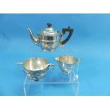 A late Victorian silver three piece Bachelor's Tea Set, by Holland, Aldwinckle & Slater,