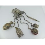 A small silver three chain Chatelaine, hallmarked London, 1996, the pierced clip with female mask,