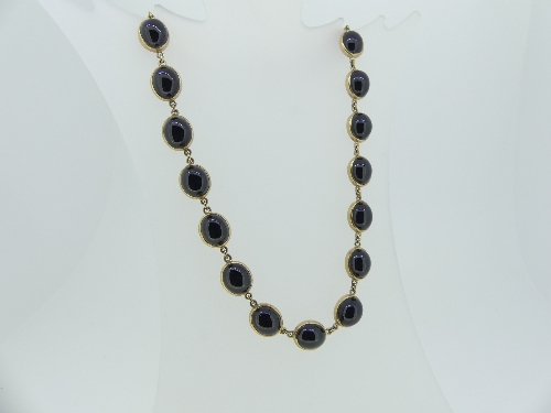 An attractive Garnet and Gold Necklace, formed of twenty closed-backed cabochon garnets, the bolt