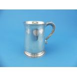 A George V silver Mug, by Searle & Co. Ltd., hallmarked London, 1934, of plain circular form with