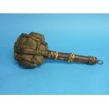 An tribal stone War Hammer, the heavy rough-hewn black stone attached to bamboo handle with cane-