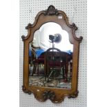 An early 20thC continental walnut framed bevel edged arched Wall Mirror, with