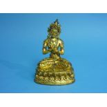 An antique Tibetan gilt bronze figure of seated Tara, possibly 16th century,