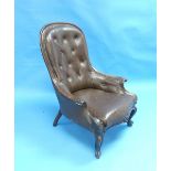 An early Victorian rosewood buttoned-back Armchair, with black leather upholstery, above moulded