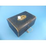 An antique leather travelling Jewellery Case, with fitted green velvet interior tray, containing a