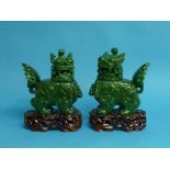 A Chinese dark spinach green jade Censers, each carved in the form of Temple Lion figures with