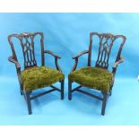 A pair of 19th century mahogany open Armchairs, each with a carved serpentine top rail above a