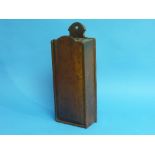 A George III oak and mahogany Candle Box, wall mounted with sliding cover, 15in (38cm) high.