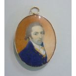 Circle of Charles Robertson (Irish, 1771-1840), oval portrait miniature of a gentleman in blue coat,