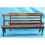 A pair of early 20th century oak Benches, each with a plain single slat back above a long seat on