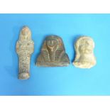 An antique Egyptian Ushabti, stone or terracotta with traces of red dye, 6in (15cm), together with