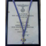 A W.W.2 period German Mutterkreuz (Cross of Honour of the German Mother), gilt metal and enamel