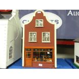 A Painted Wood Dutch Gable Dolls House, 3 storey house including ground floor as shop front,
