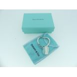 A silver Tiffany & Co. heart-shaped Key Ring, suspending a signed heart-shaped tag, both marked