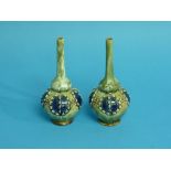 A pair of Royal Doulton stoneware bottle Vases, with globular bodies and slender necks, 6in (15cm)