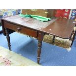 A 19th century mahogany Pembroke Table, the rectangular top with rounded corners and moulded edge