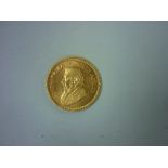 A South African 1oz Fine Gold Krugerrand, dated 1974.