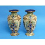 Frank Butler for Royal Doulton, a pair of stoneware baluster vases, each decorated in the Art