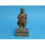 An antique Continental wooden carving or Jesus Christ, the naively-worked standing robed figure