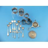 A quantity of Silver Items, including seven various napkin rings, salt spoons, powder compact, tea