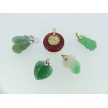Six jade Pendants, two carved with fruit, both with gold suspension fittings marked 585, four others