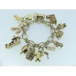 A 9ct gold Bracelet, formed of open circles with a bar across each, with 9ct padlock clasp, with