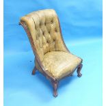 An early Victorian rosewood buttoned-back Nursing Chair, with tan leather upholstery, above