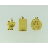 A 999.9 Credit Suisse fine yellow gold Ingot Pendant, 2.5g, together with a cat pendant, marked on