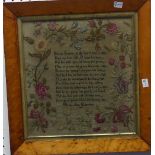 An early 19th century Sampler, with a verse surrounded by a wide floral border, by "Martha Ann