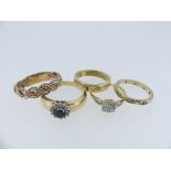 A collection of five Rings, including an unmarked wedding band, 5.5g, Size P, a sapphire and white