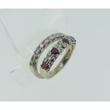 A platinum and diamond half hoop Eternity Ring, with fourteen brilliant cut stones, approx total