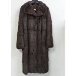 Vintage Fashion: a 1950s dark brown fur full-length duster Coat, with heavy jacquard satin lining,
